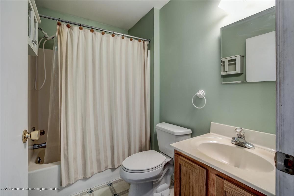 6 Bash Road Toms River, NJ 08753 - Photo 10 of 19 a bathroom with a sink toilet and shower