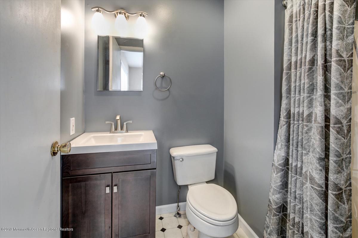 6 Bash Road Toms River, NJ 08753 - Photo 15 of 19 a bathroom with a toilet sink and mirror