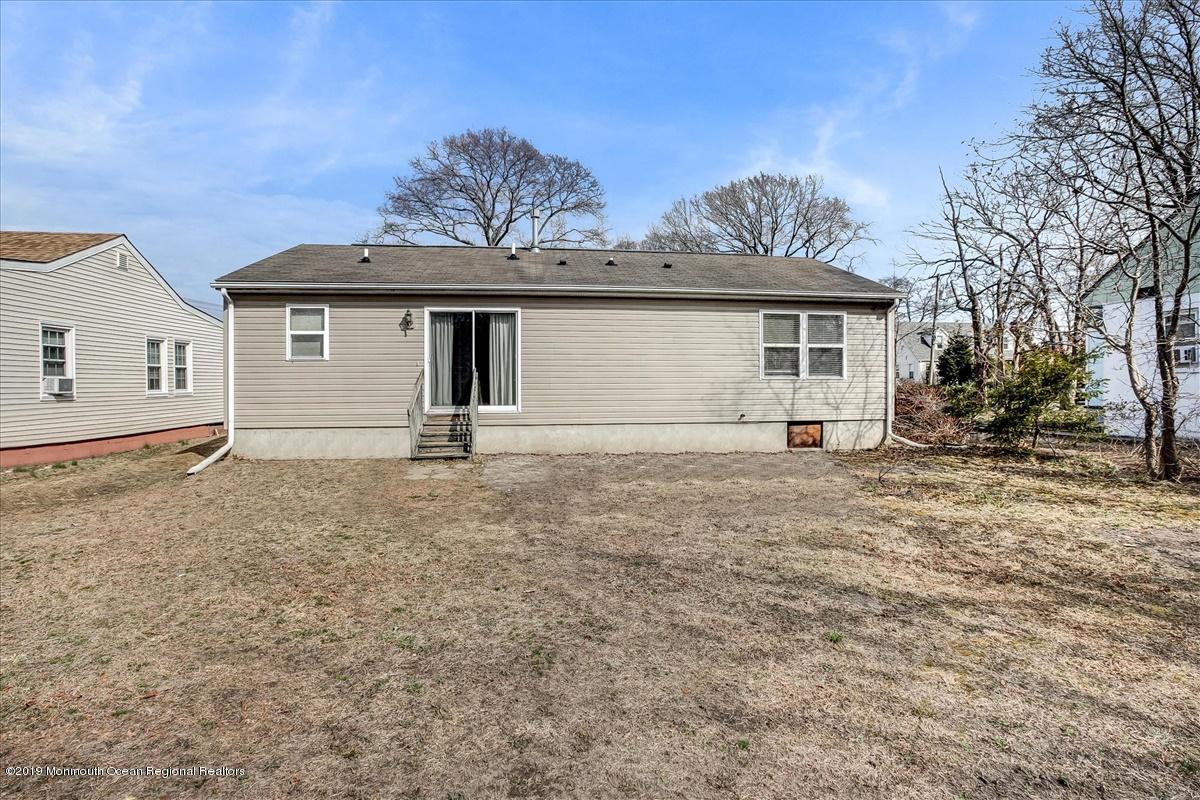 6 Bash Road Toms River, NJ 08753 - Photo 16 of 19 a front view of a house with garden