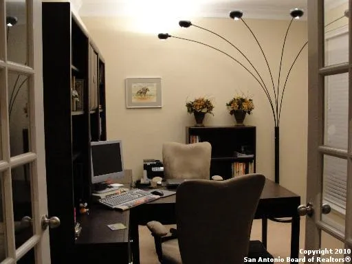 a view of a workspace with furniture