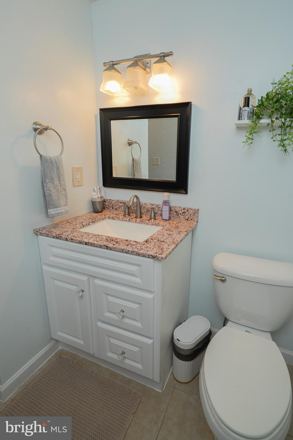 1816 Cremen Road Pasadena, MD 21122 - Photo 24 of 46 a bathroom with a toilet sink and mirror