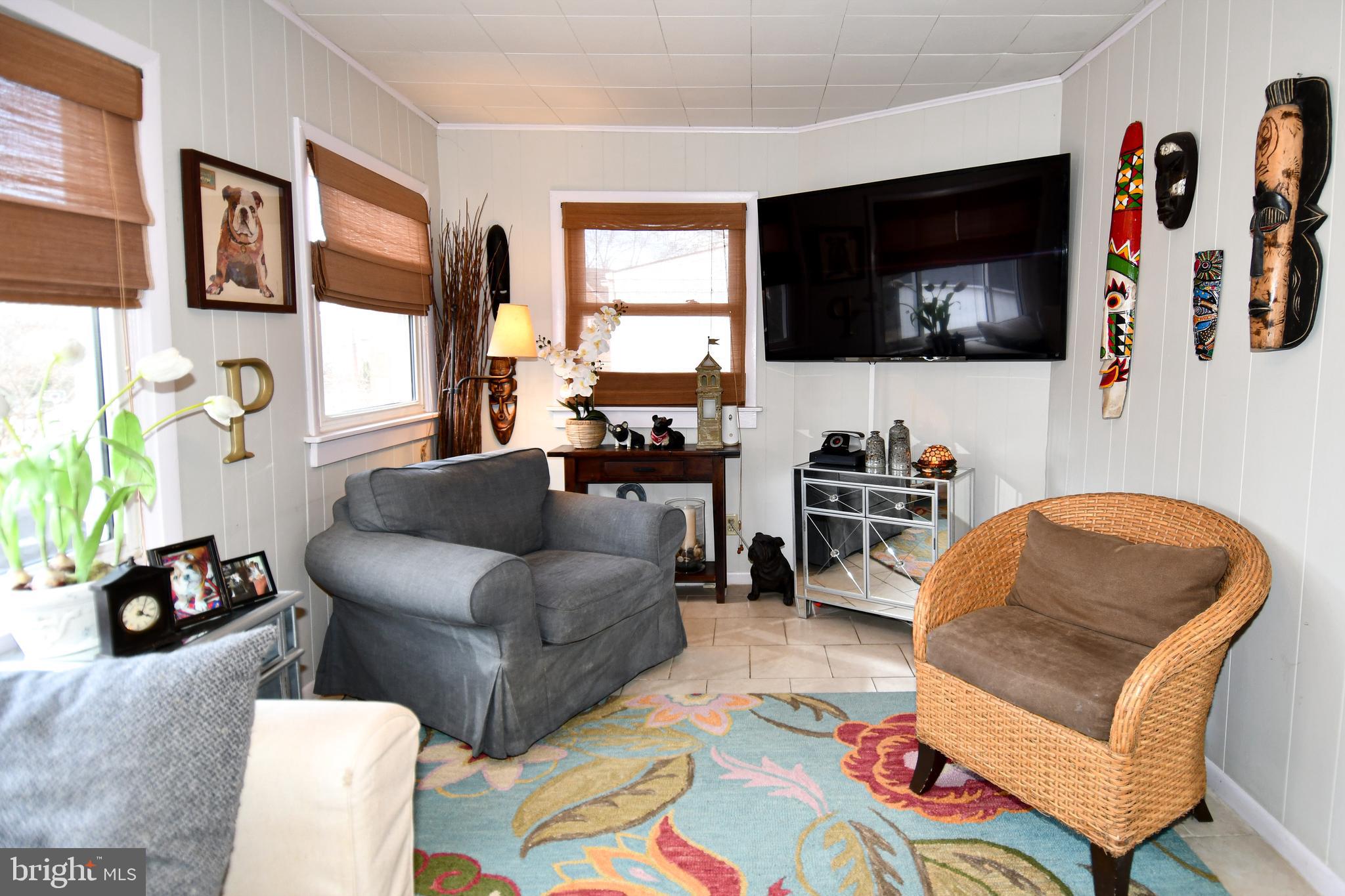 6208 Sligo Mill Road Northeast Washington, DC 20011 - Photo 14 of 50 a living room with furniture and a flat screen tv