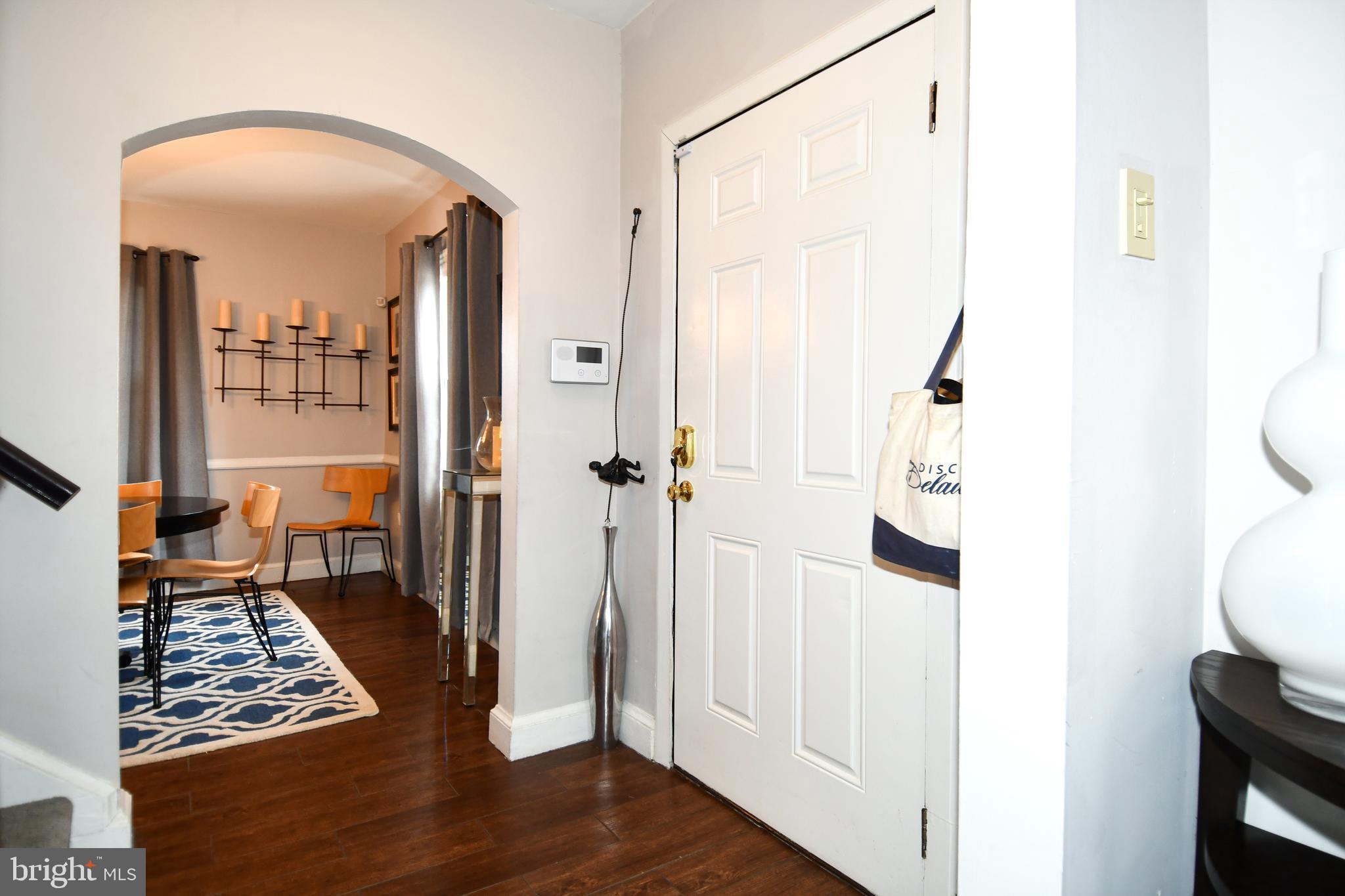 6208 Sligo Mill Road Northeast Washington, DC 20011 - Photo 15 of 50 a view of a hallway with wooden floor and a living room