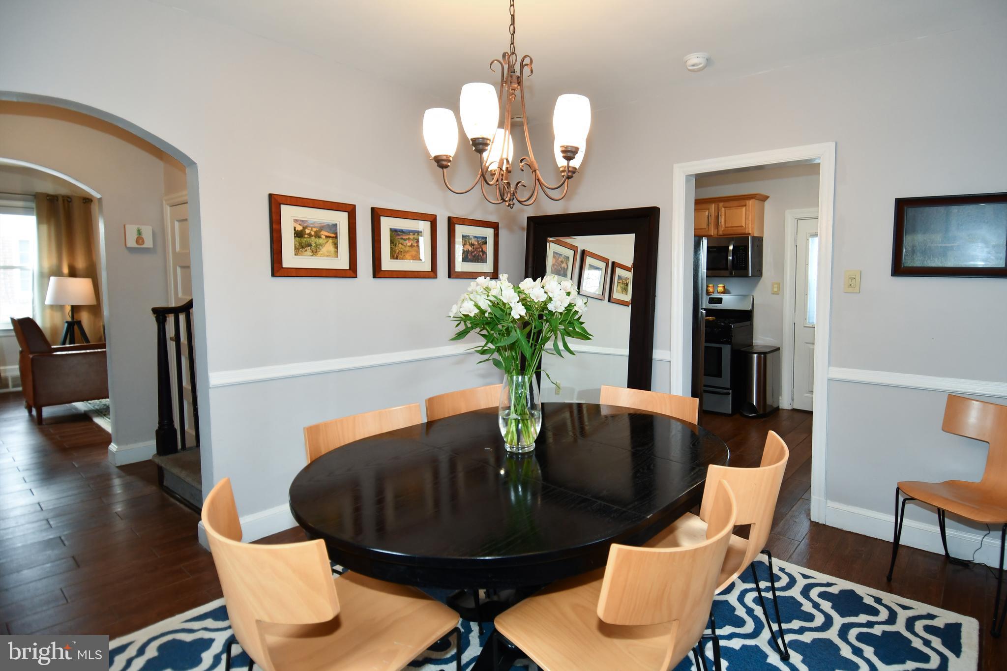6208 Sligo Mill Road Northeast Washington, DC 20011 - Photo 18 of 50 a view of a dining room with furniture and wooden floor