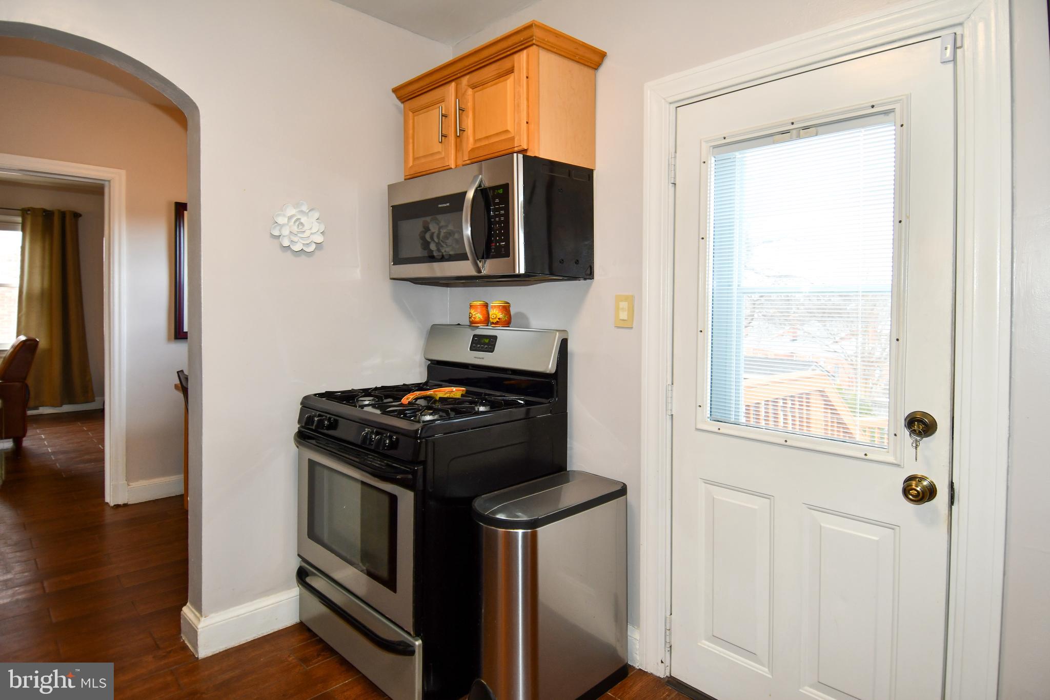 6208 Sligo Mill Road Northeast Washington, DC 20011 - Photo 24 of 50 a kitchen with a stove and a microwave