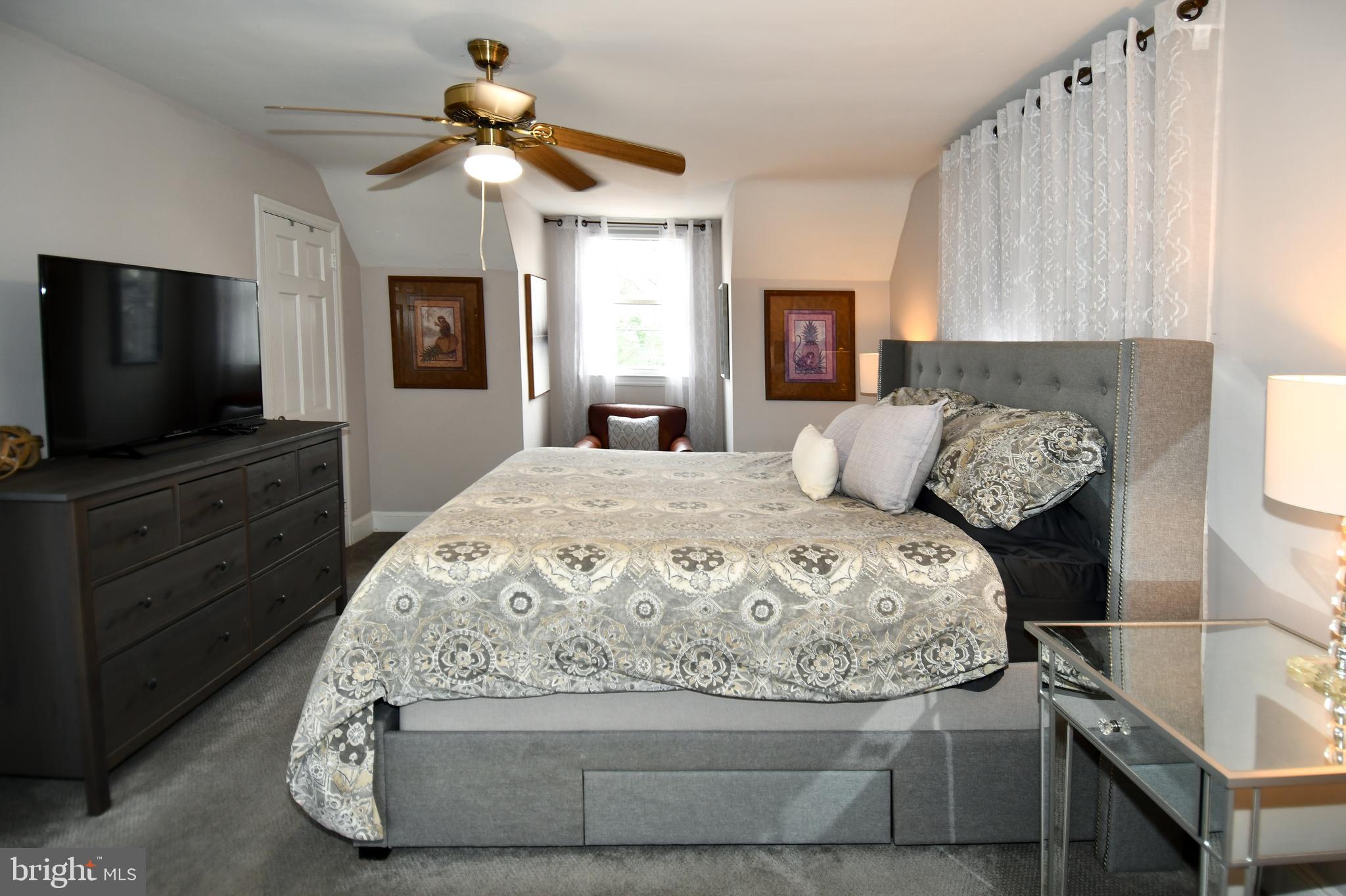 6208 Sligo Mill Road Northeast Washington, DC 20011 - Photo 29 of 50 a bedroom with a bed and a flat screen tv