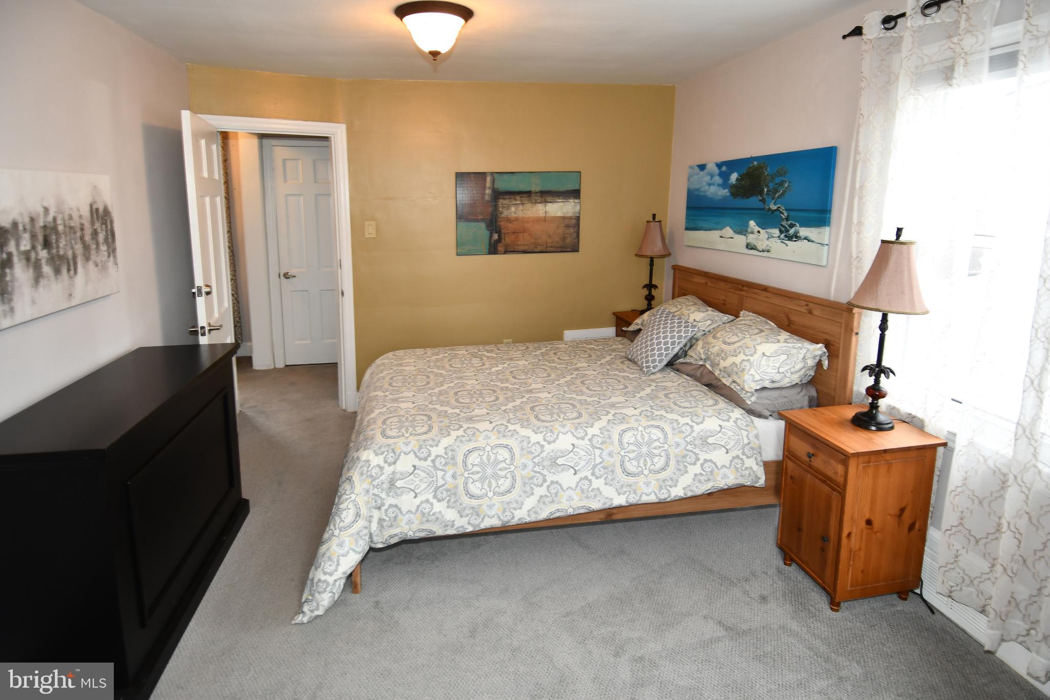 6208 Sligo Mill Road Northeast Washington, DC 20011 - Photo 31 of 50 a bedroom with a bed and a flat screen tv