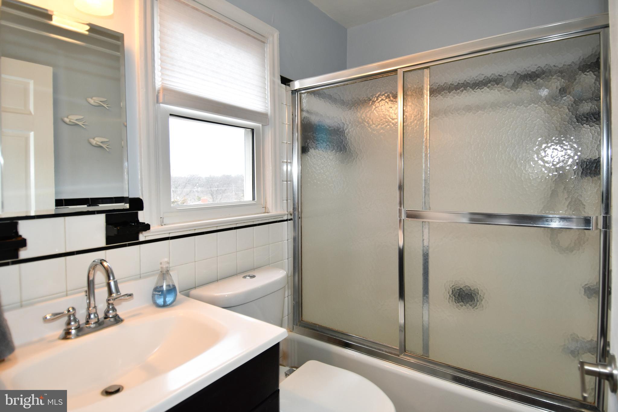 6208 Sligo Mill Road Northeast Washington, DC 20011 - Photo 32 of 50 a bathroom with a sink toilet and shower
