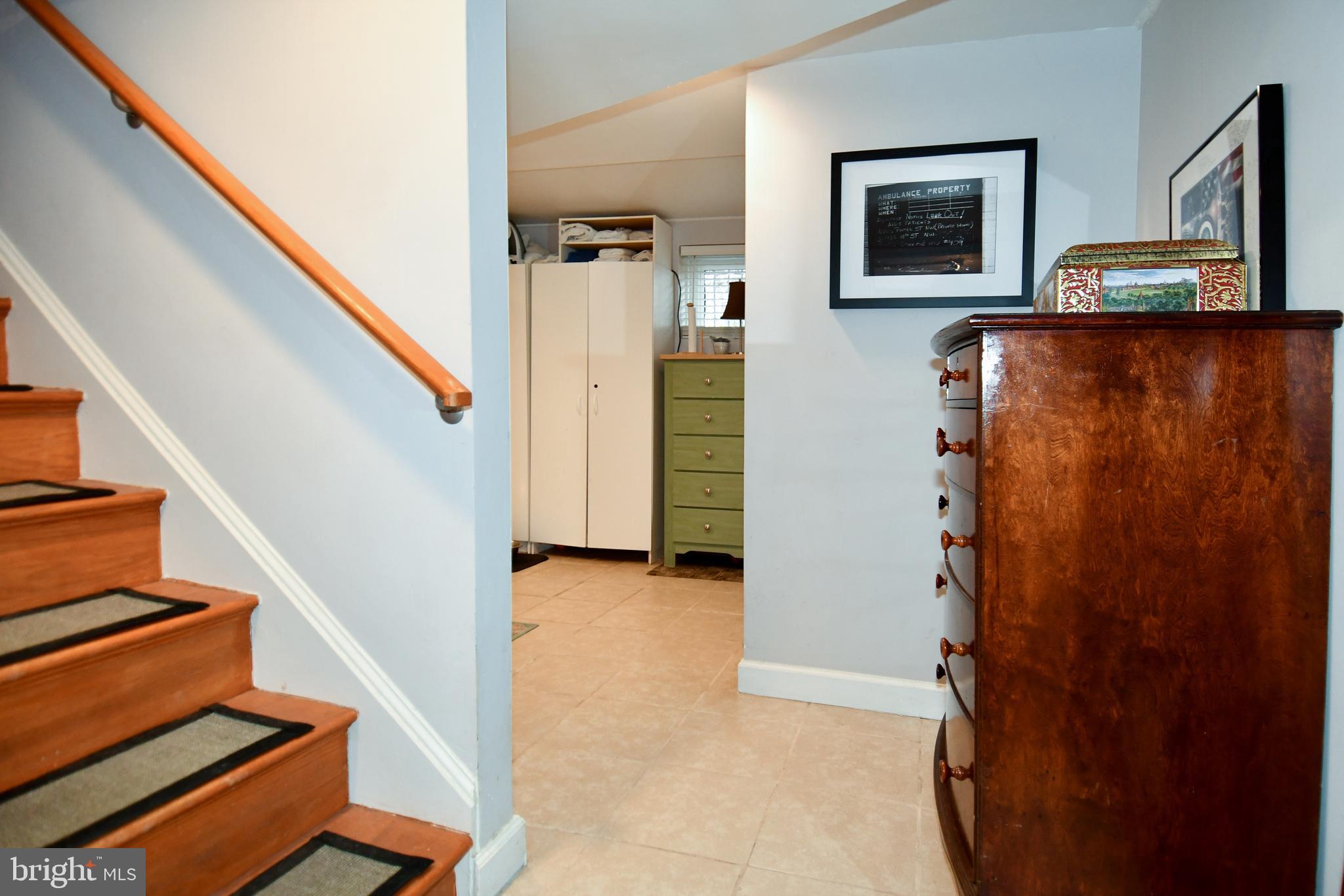 6208 Sligo Mill Road Northeast Washington, DC 20011 - Photo 40 of 50 a view of an entryway with paintings on the wall
