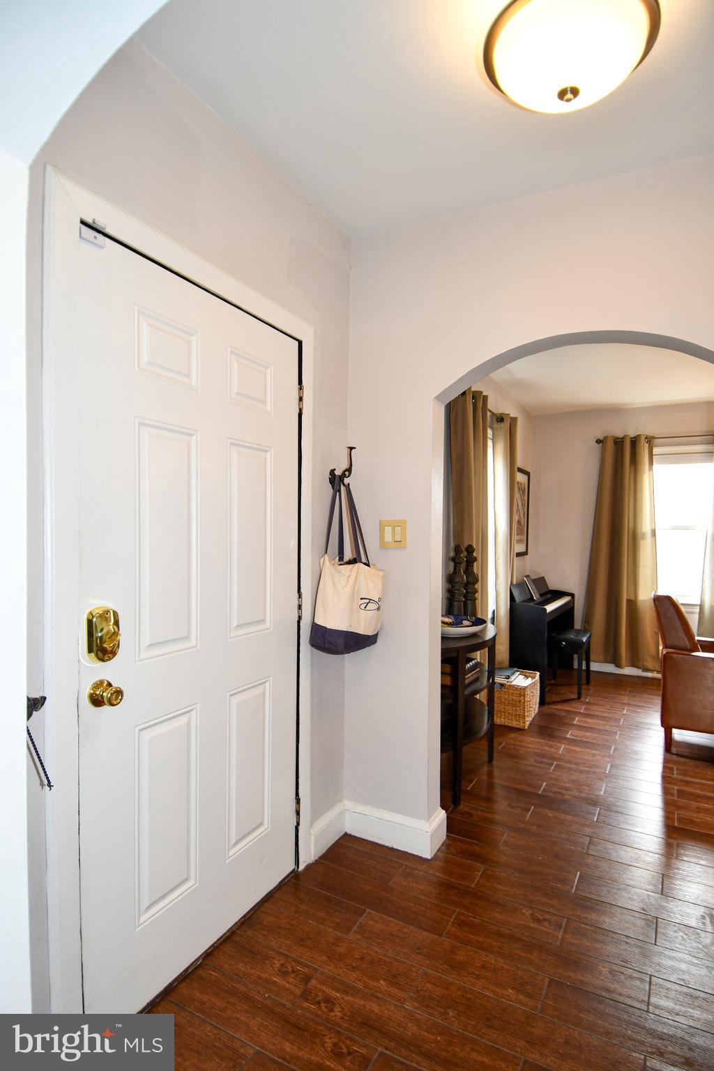 6208 Sligo Mill Road Northeast Washington, DC 20011 - Photo 4 of 50 a view of livingroom with hardwood floor and hallway