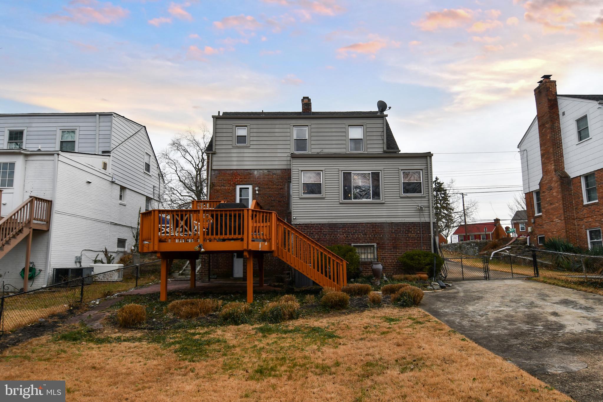 6208 Sligo Mill Road Northeast Washington, DC 20011 - Photo 46 of 50 a front view of a house with a yard