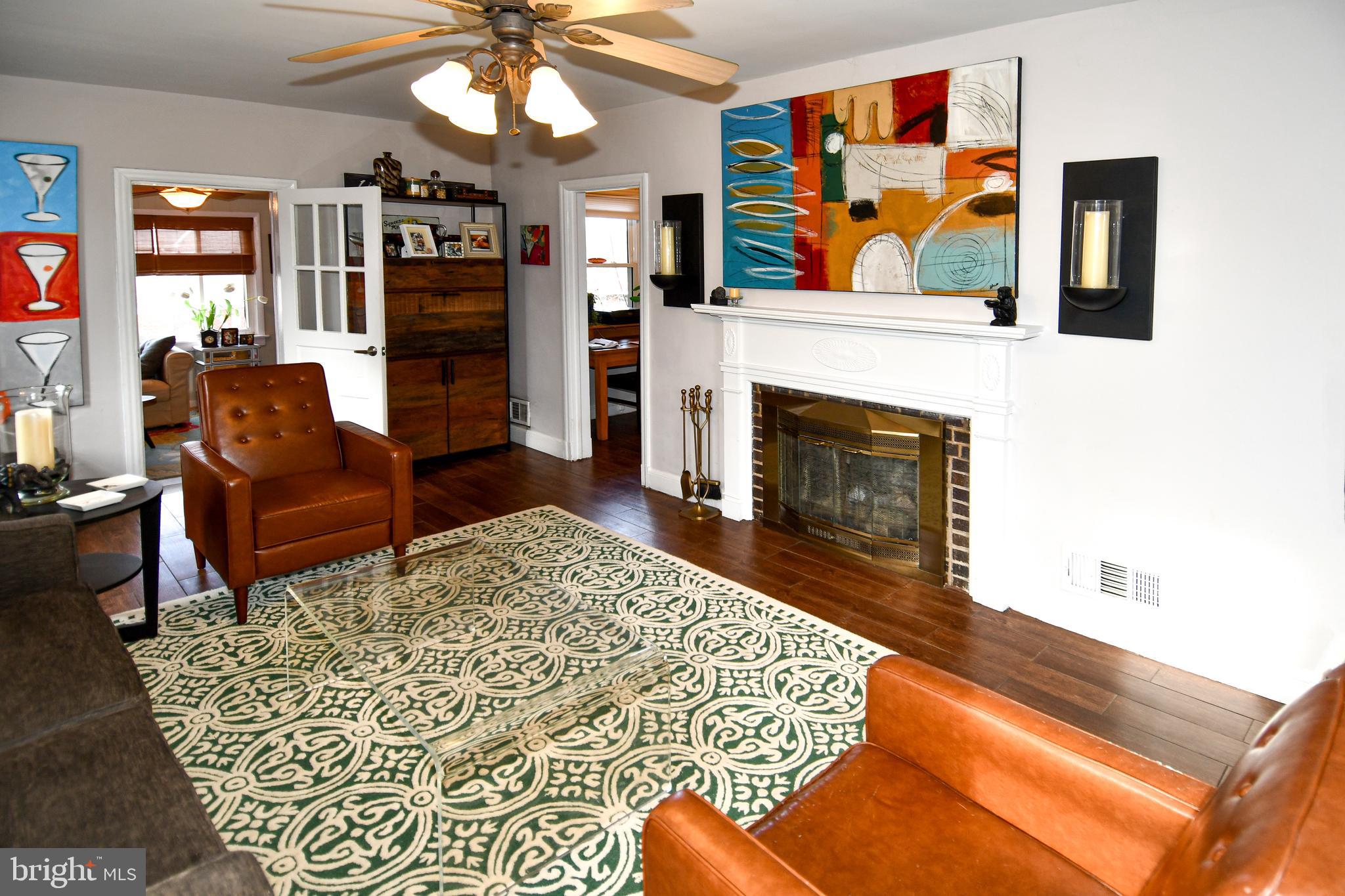 6208 Sligo Mill Road Northeast Washington, DC 20011 - Photo 8 of 50 a living room with furniture and a fireplace