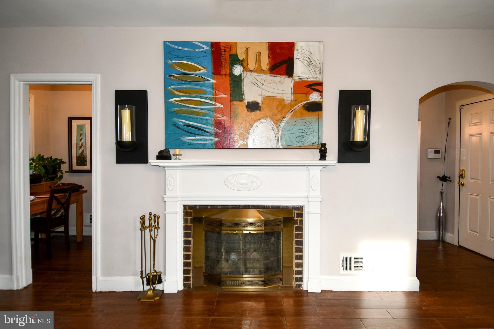 6208 Sligo Mill Road Northeast Washington, DC 20011 - Photo 9 of 50 a living room with wooden floor and a fireplace