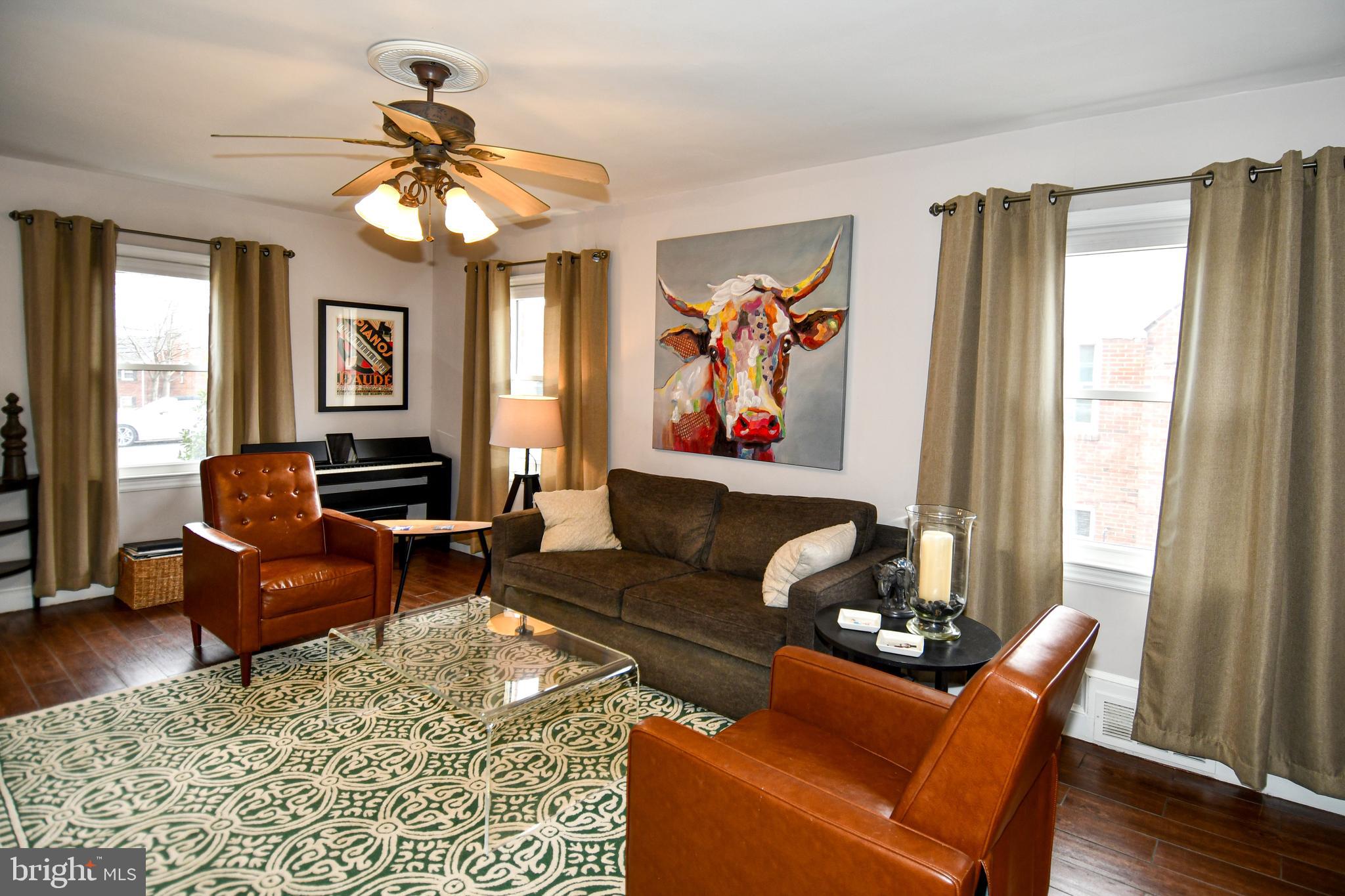 6208 Sligo Mill Road Northeast Washington, DC 20011 - Photo 10 of 50 a living room with furniture and a large window