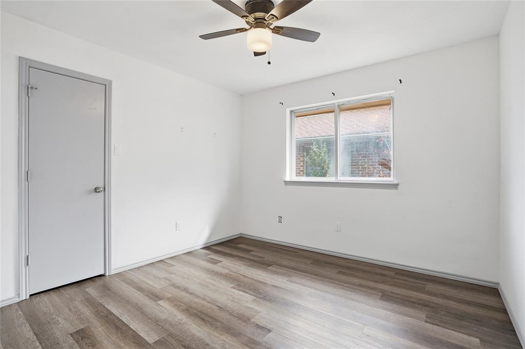 4612 Applewood Road Fort Worth, TX 76133 - Photo 15 of 39 Empty room with light wood finished floors and ceiling fan