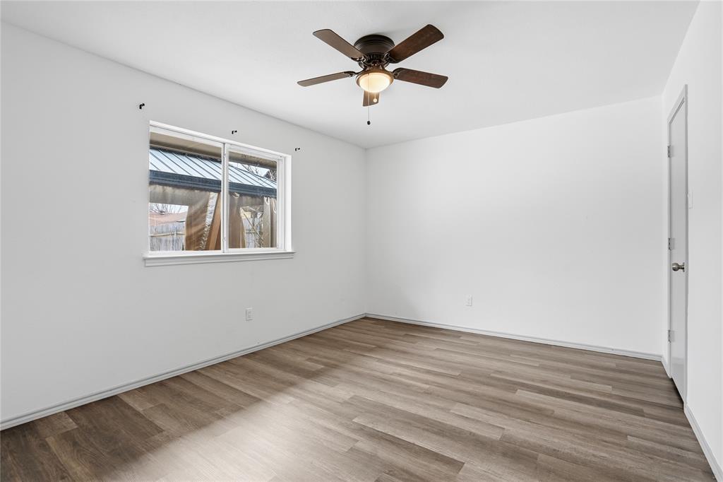 4612 Applewood Road Fort Worth, TX 76133 - Photo 16 of 39 Spare room with light wood-type flooring and ceiling fan