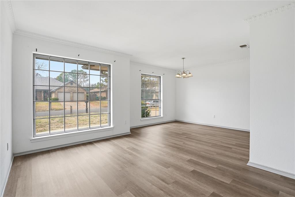 4612 Applewood Road Fort Worth, TX 76133 - Photo 18 of 39 Unfurnished dining area featuring a chandelier, light wood-type flooring, and ornamental molding