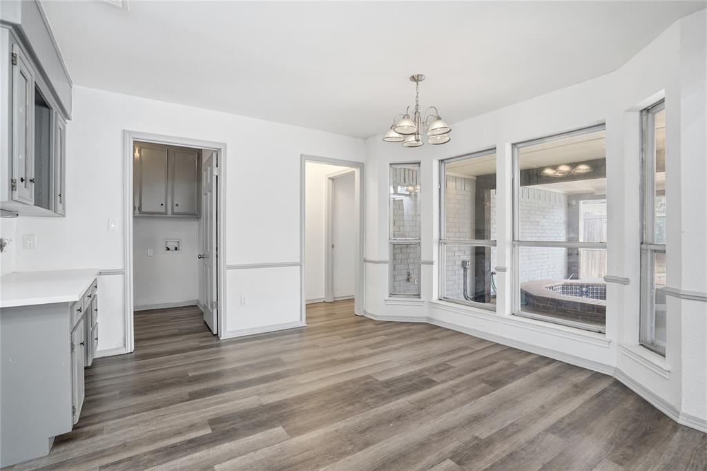 4612 Applewood Road Fort Worth, TX 76133 - Photo 24 of 39 Unfurnished dining area featuring a chandelier and light wood-type flooring