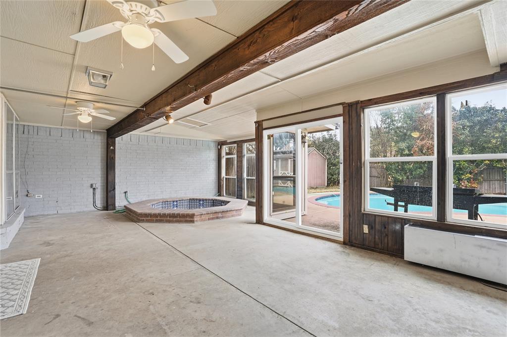 4612 Applewood Road Fort Worth, TX 76133 - Photo 34 of 39 Unfurnished sunroom with radiator heating unit and beamed ceiling