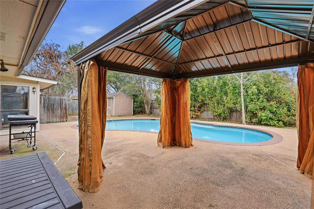 4612 Applewood Road Fort Worth, TX 76133 - Photo 36 of 39 View of pool featuring a patio area, a storage unit, a fenced backyard, and a gazebo