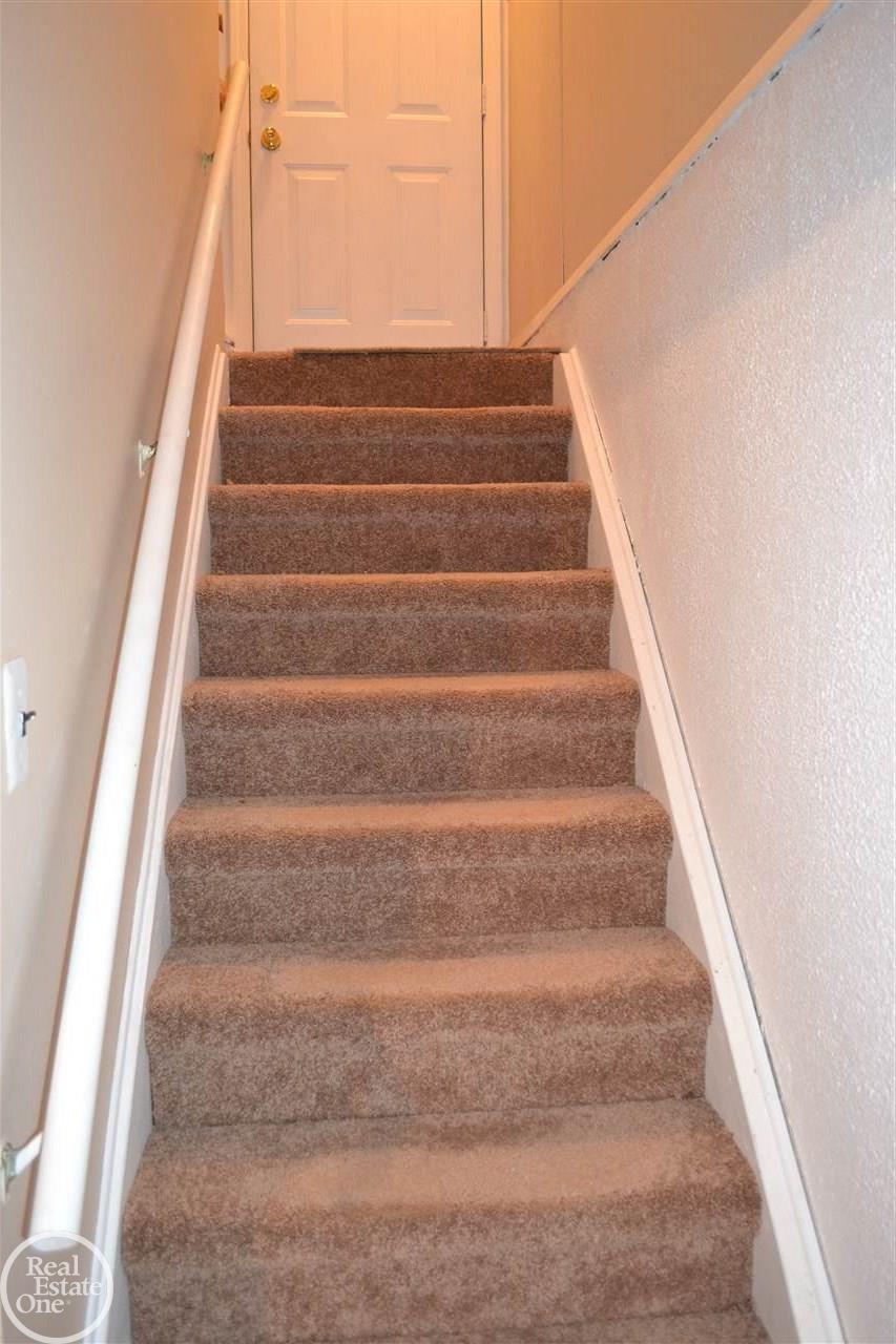 11211 Toepfer Road Warren, MI 48089 - Photo 12 of 19 Carpeted Basement Stairs