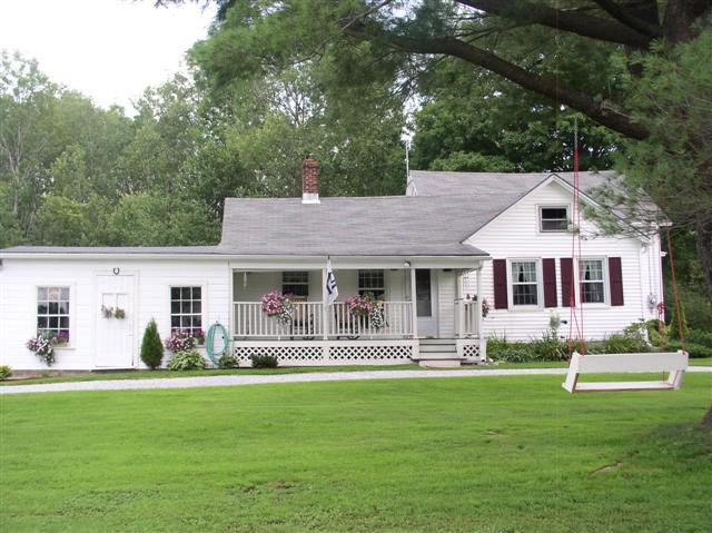 493 Main Road Stamford, VT 05352 - Photo 1 of 24 a front view of house with yard and green space