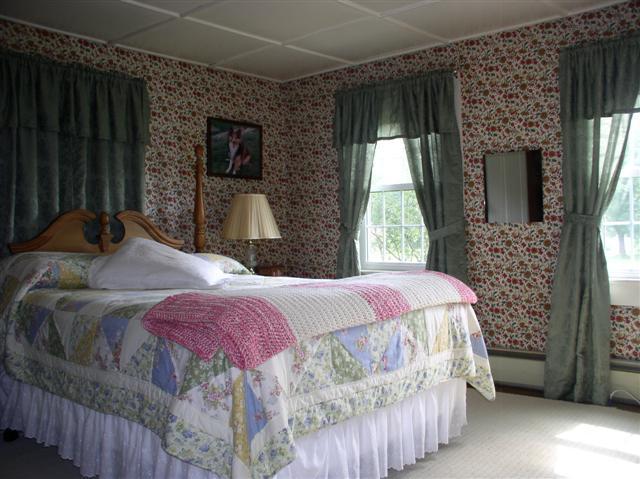 493 Main Road Stamford, VT 05352 - Photo 14 of 24 a bedroom with a bed and a window
