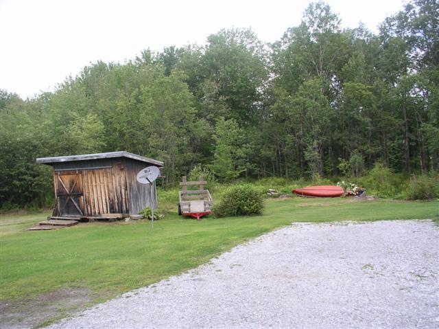 493 Main Road Stamford, VT 05352 - Photo 21 of 24 a view of a house with backyard and garden