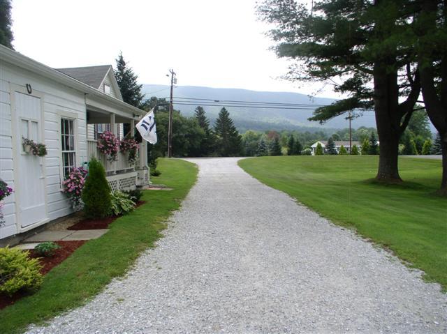 493 Main Road Stamford, VT 05352 - Photo 23 of 24 a view of a house with a yard