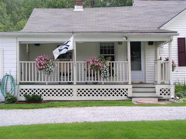 493 Main Road Stamford, VT 05352 - Photo 9 of 24 a front view of a house with a garden