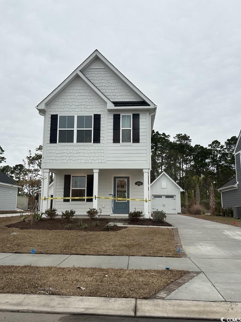 2809 Rowyn Street Longs, SC 29568 - Photo 1 of 1 View of front of property with a porch, driveway, and an outbuilding