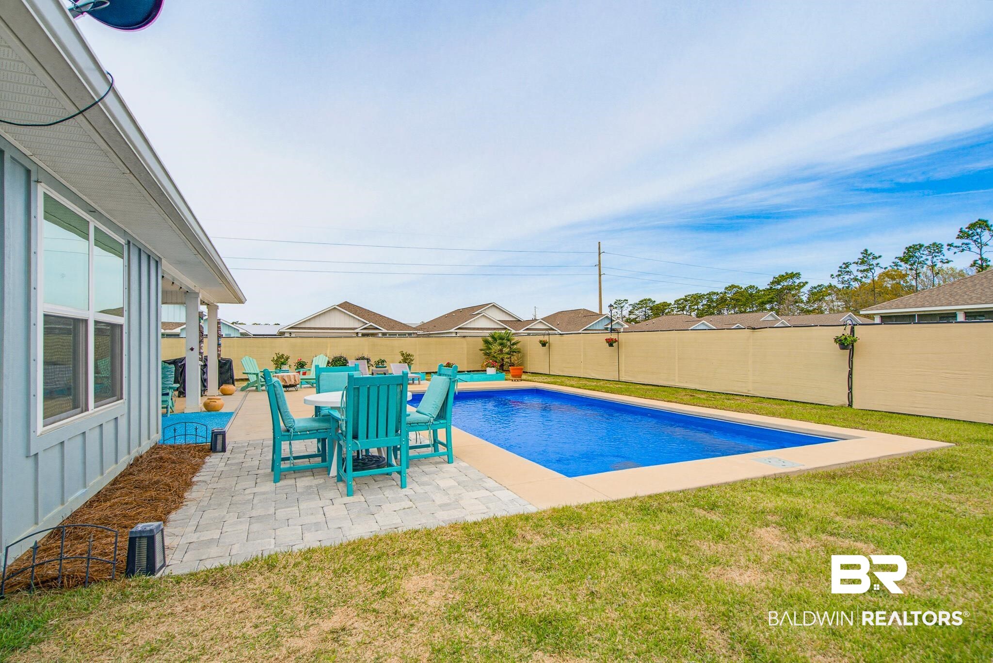 261 Fulham Lane Foley, AL 36535 - Photo 44 of 50 View of swimming pool featuring patio surround, a fenced backyard, and outdoor dining area