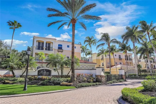 a balcony with couple of potted plants