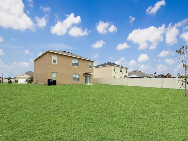 a view of a house with a big yard