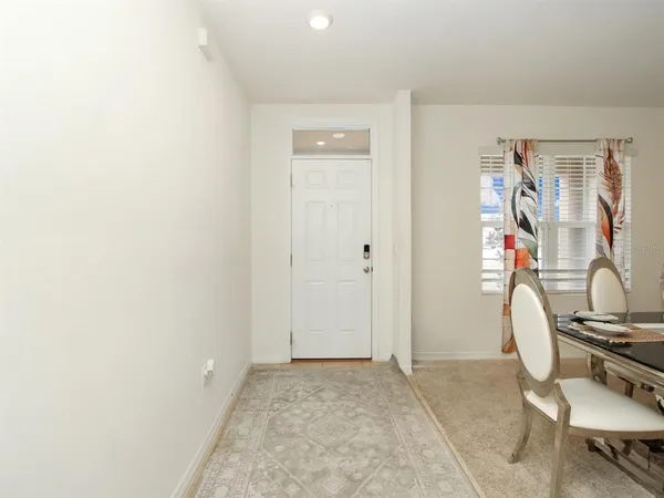 a view of room with furniture and wooden floor