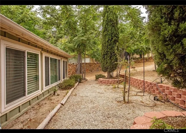 a backyard of a house with a tree