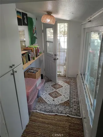 a view of a chairs and table in the patio