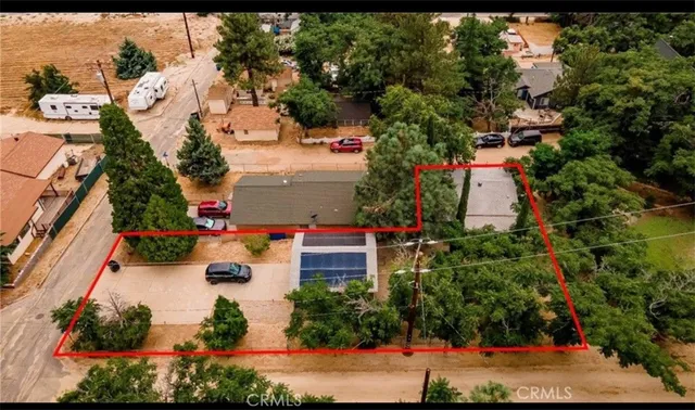 an aerial view of a houses with outdoor space