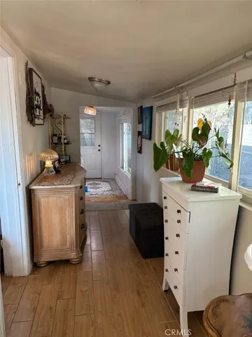 a kitchen with sink cabinets and wooden floor