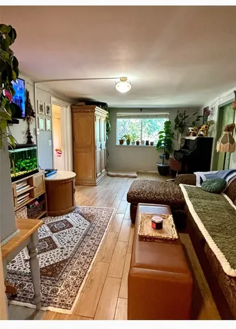 a living room with lots of furniture and a rug