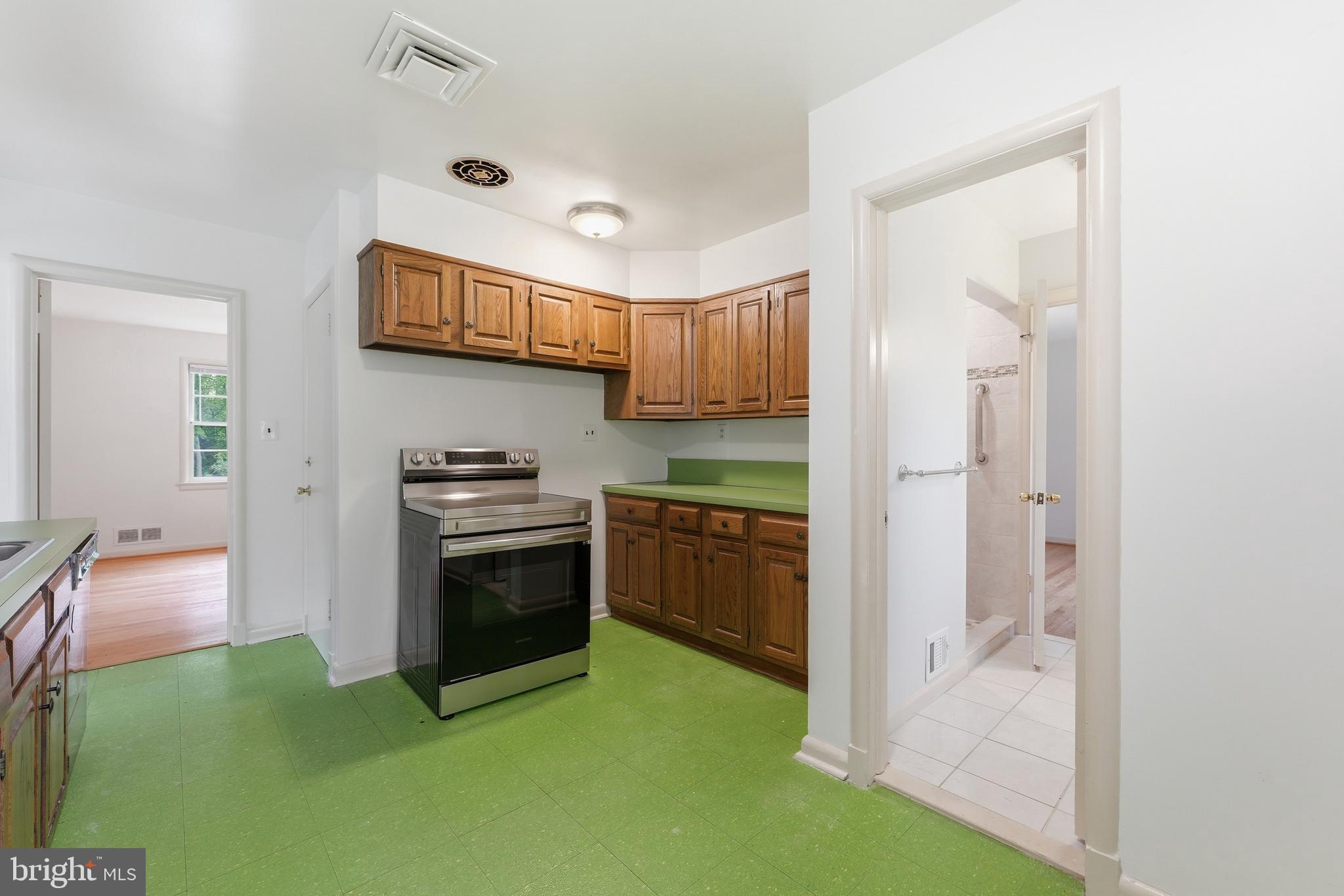 228 Northwest Terrace Silver Spring, MD 20901 - Photo 10 of 70 a kitchen with a sink and a stove top oven