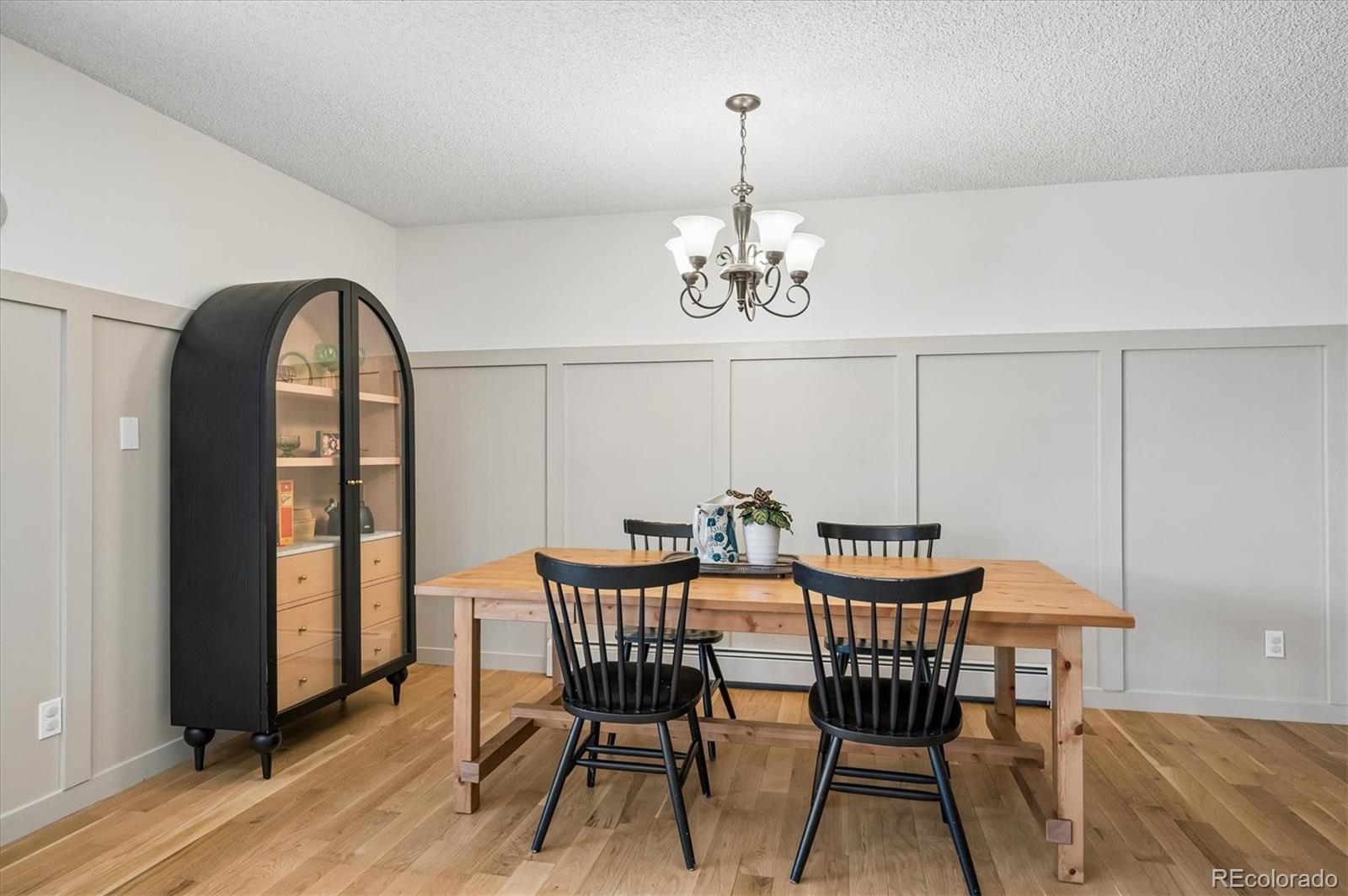4654 South Union Street Morrison, CO 80465 - Photo 12 of 34 a view of a dining room with furniture window and wooden floor