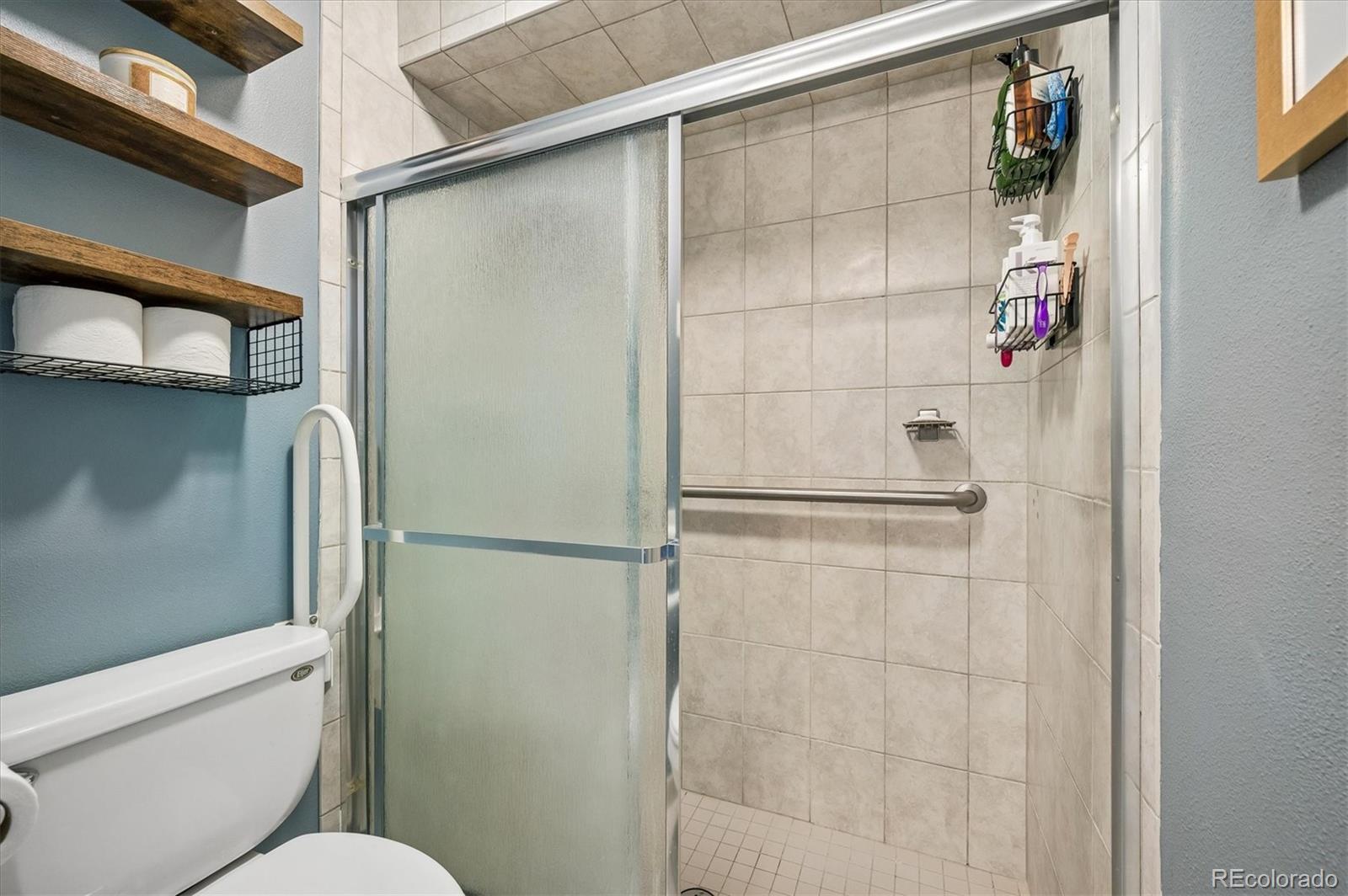 4654 South Union Street Morrison, CO 80465 - Photo 16 of 34 a bathroom with a shower