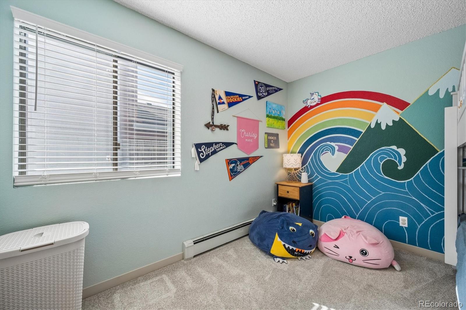 4654 South Union Street Morrison, CO 80465 - Photo 18 of 34 a bedroom with a bed and a window