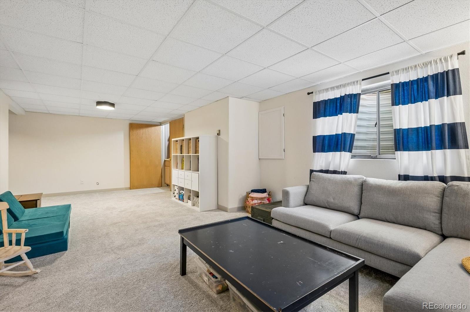 4654 South Union Street Morrison, CO 80465 - Photo 21 of 34 a living room with furniture and a window