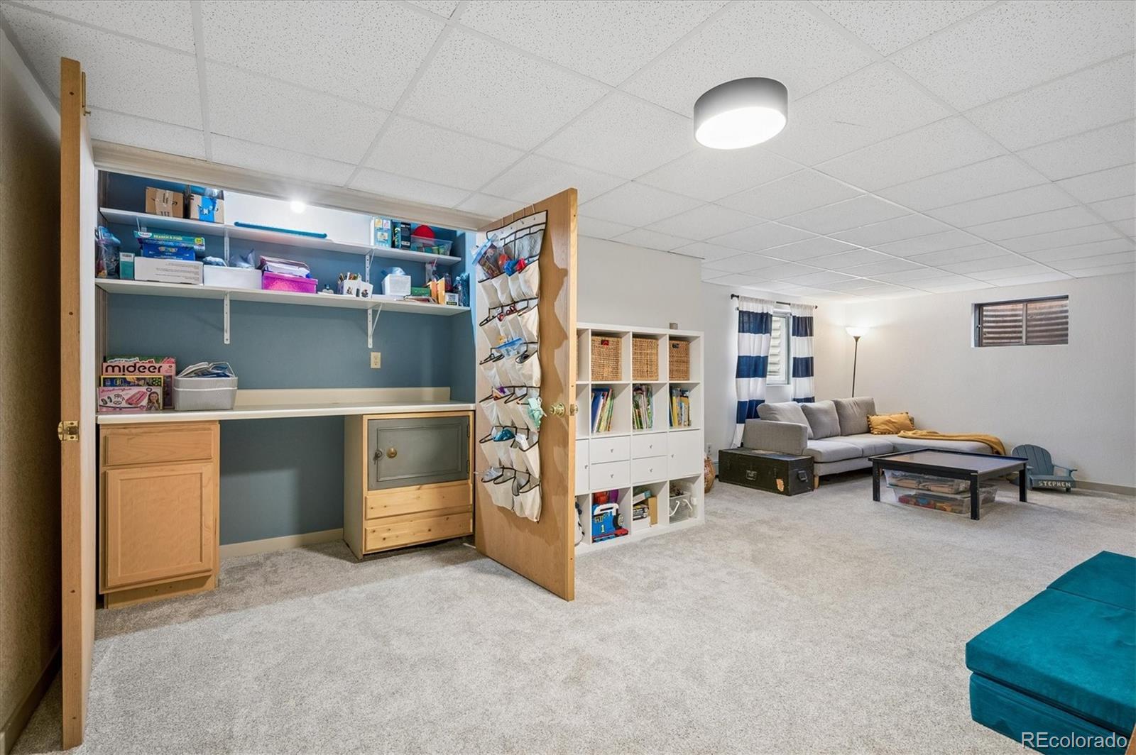 4654 South Union Street Morrison, CO 80465 - Photo 23 of 34 a room with furniture and white walls