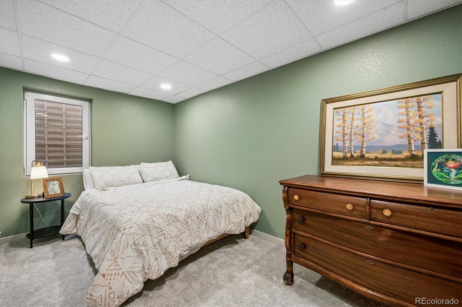 4654 South Union Street Morrison, CO 80465 - Photo 24 of 34 a bedroom with a bed and a window