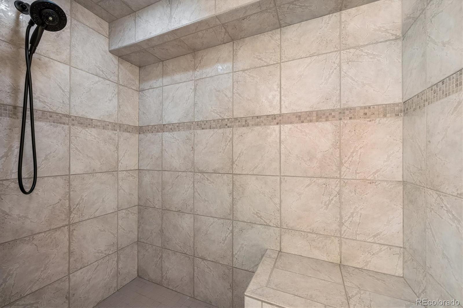 4654 South Union Street Morrison, CO 80465 - Photo 27 of 34 a bathroom with a shower