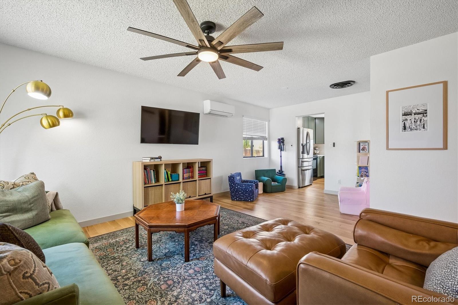 4654 South Union Street Morrison, CO 80465 - Photo 5 of 34 a living room with furniture and a flat screen tv