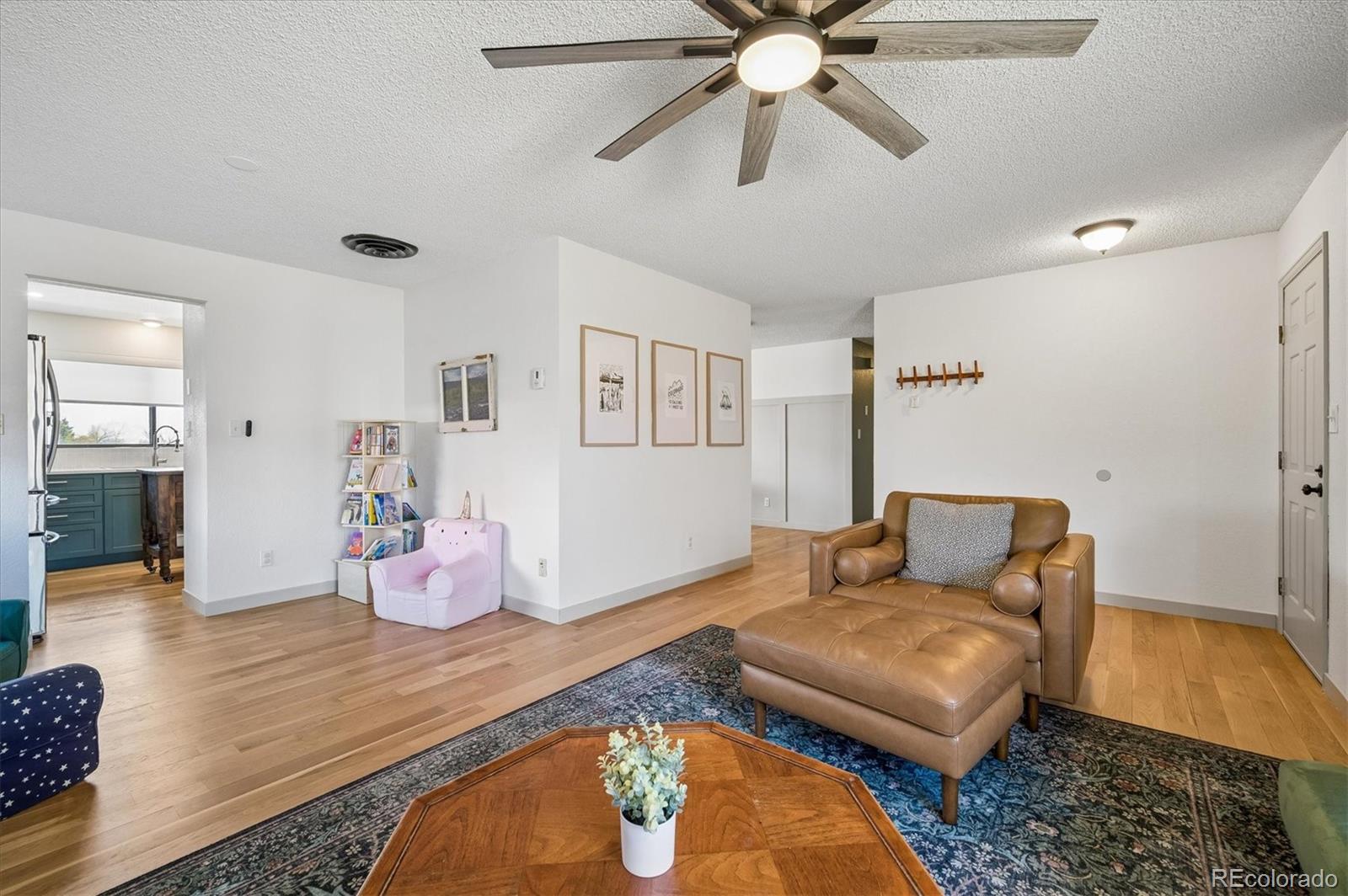 4654 South Union Street Morrison, CO 80465 - Photo 6 of 34 a living room with furniture and wooden floor